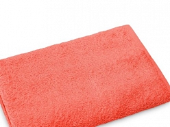 Oranžs frotē dvielis – mīksts un absorbējošs tekstils